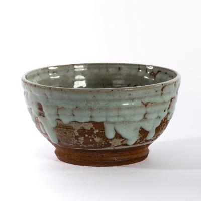 Appraisal: Cole Pottery Katharine Pleydell-Bouverie an earthenware bowl with celadon drip