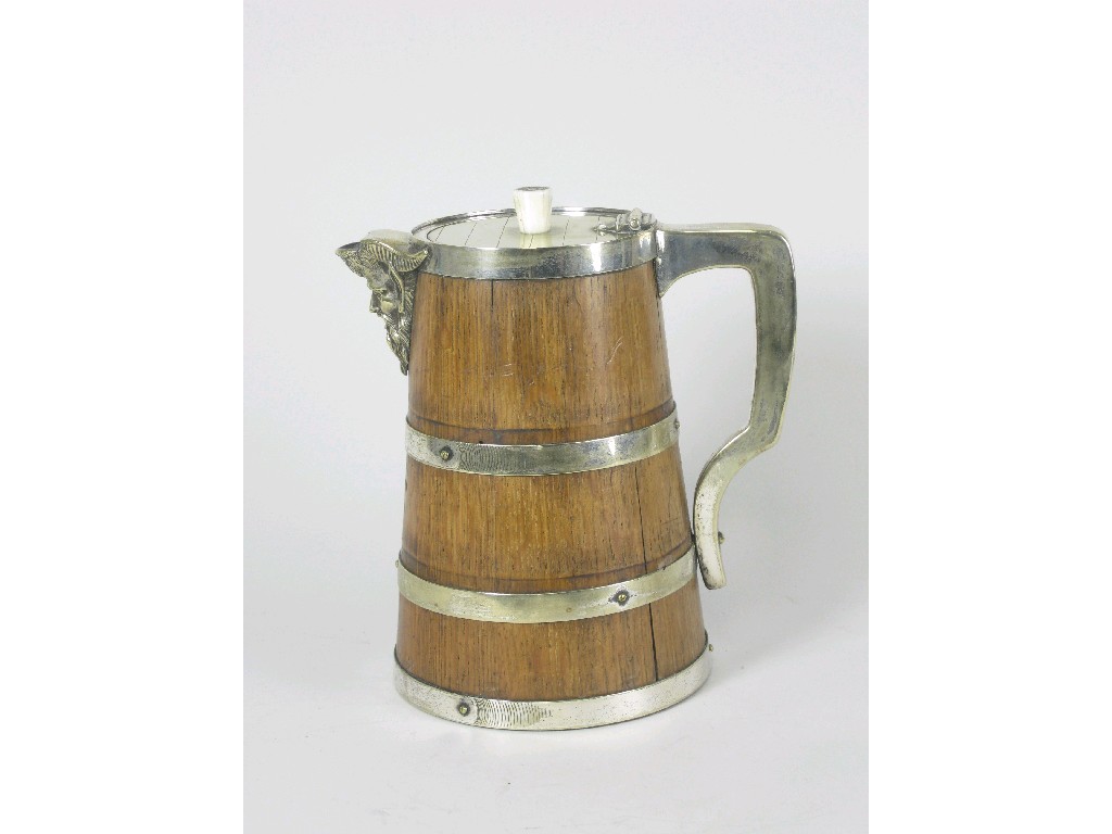 Appraisal: An oak and silver plated Jug of tapering cylindrical form