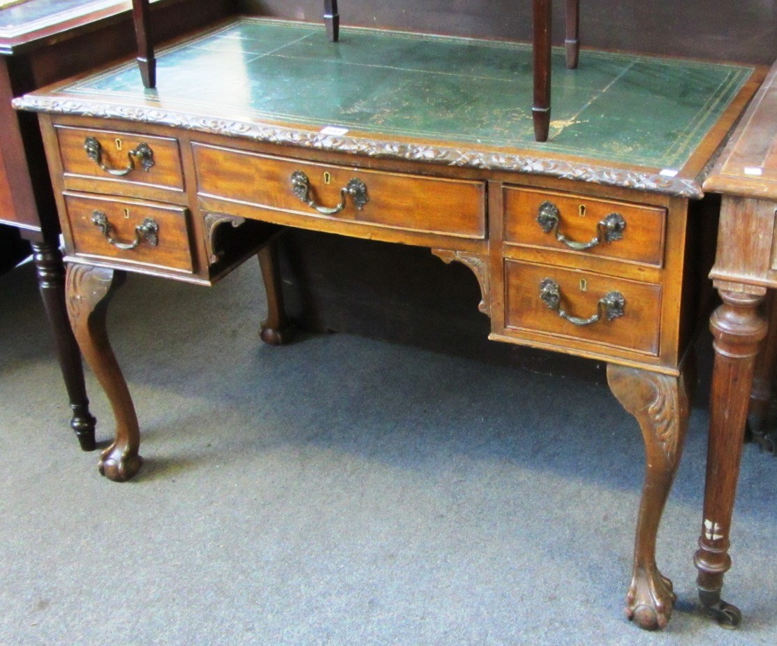 Appraisal: An early th century mahogany writing desk the leather top