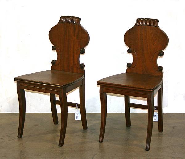 Appraisal: A pair of Victorian mahogany hall chairs th century height