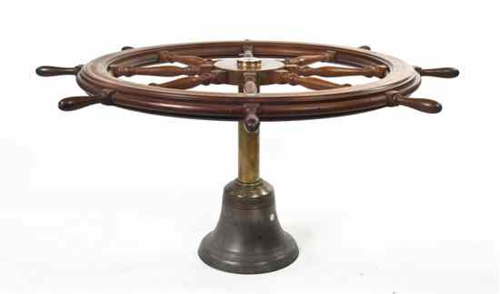 Appraisal: A Brass Ship Wheel Dining Table American Engineering Company with