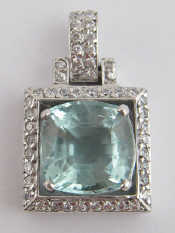 Appraisal: A white metal tests carat gold aquamarine pendant drop approx