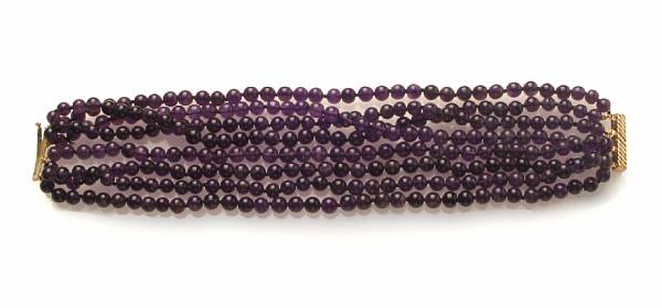 Appraisal: An amethyst multi-strand beaded bracelet with k gold clasp strand