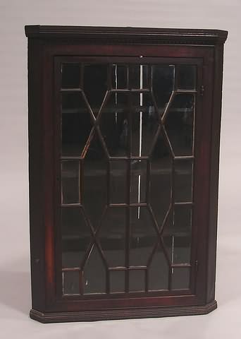 Appraisal: Single door with lattice work mullions shaped interior shelves with