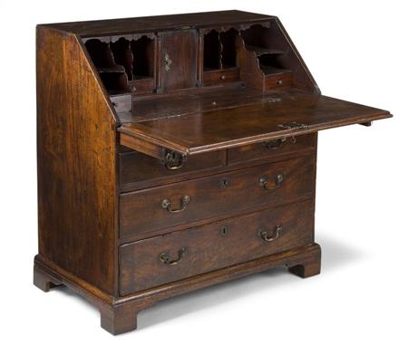 Appraisal: A George II mahogany bureau circa fall front enclosing a