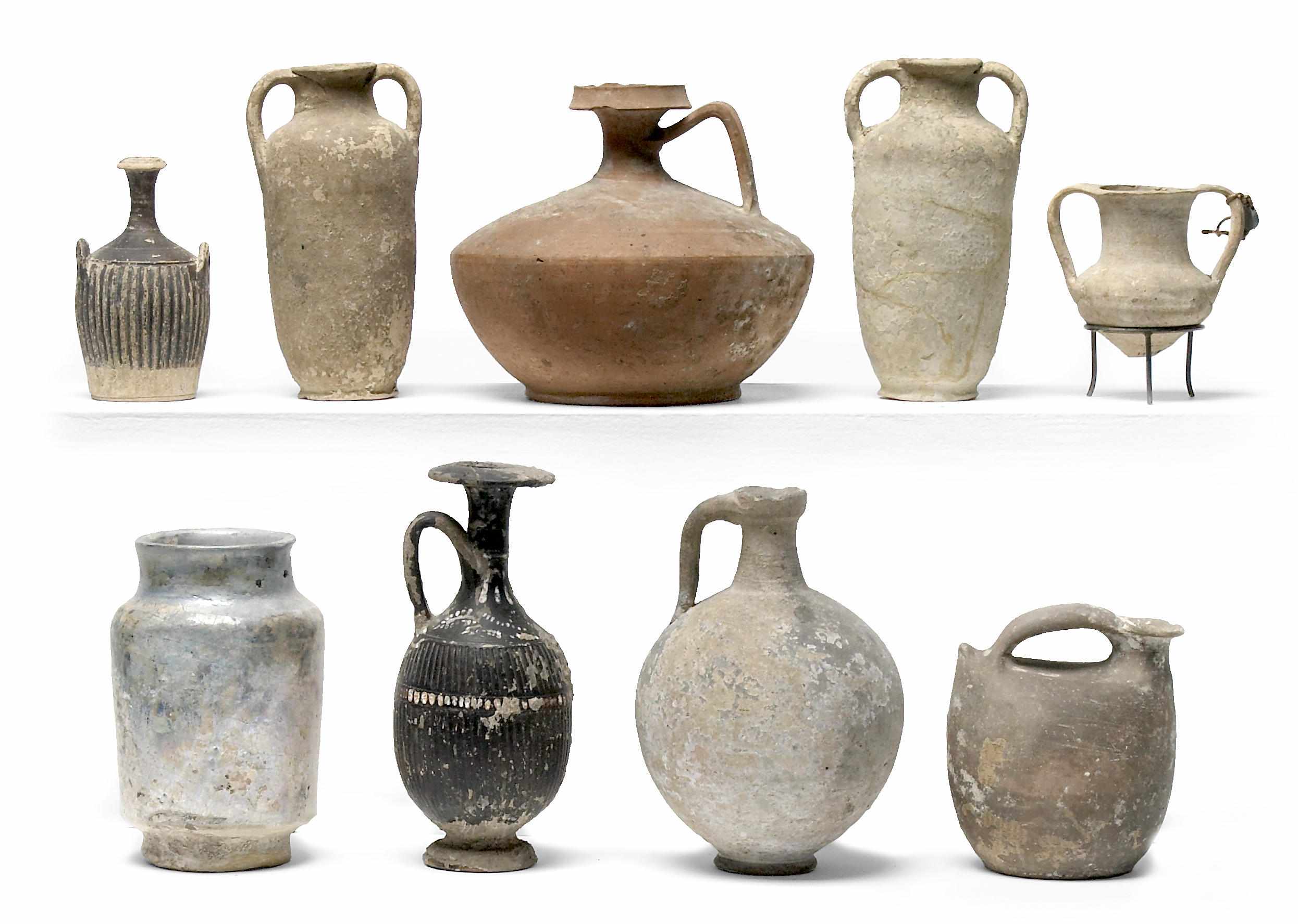 Appraisal: A grouping of eighteen vessels Including a Roman pottery flask