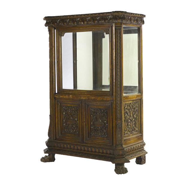 Appraisal: Carved oak curio cabinet ca - With beveled glass and