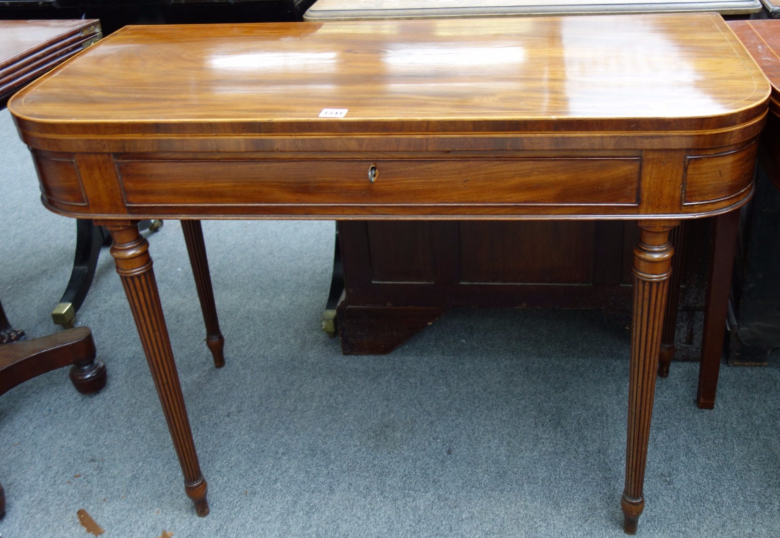 Appraisal: A late George III inlaid mahogany tea table with single