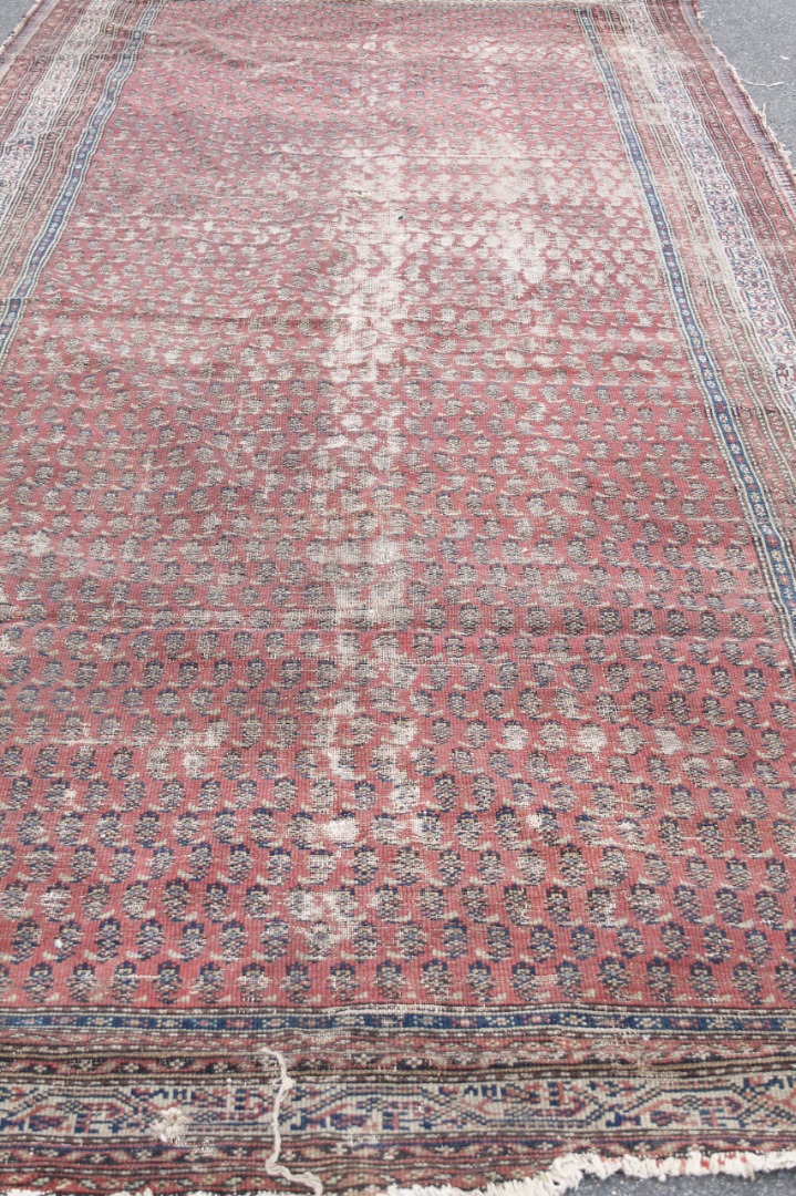 Appraisal: An early thC rug of geometric pattern predominantly in blue