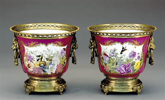 Appraisal: Pair porcelain and gilt-metal cachepots pierced rim with lion's-head handles