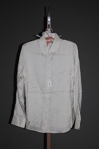 Appraisal: Loro Piana ivory long sleeve silk blouse with shirt collar