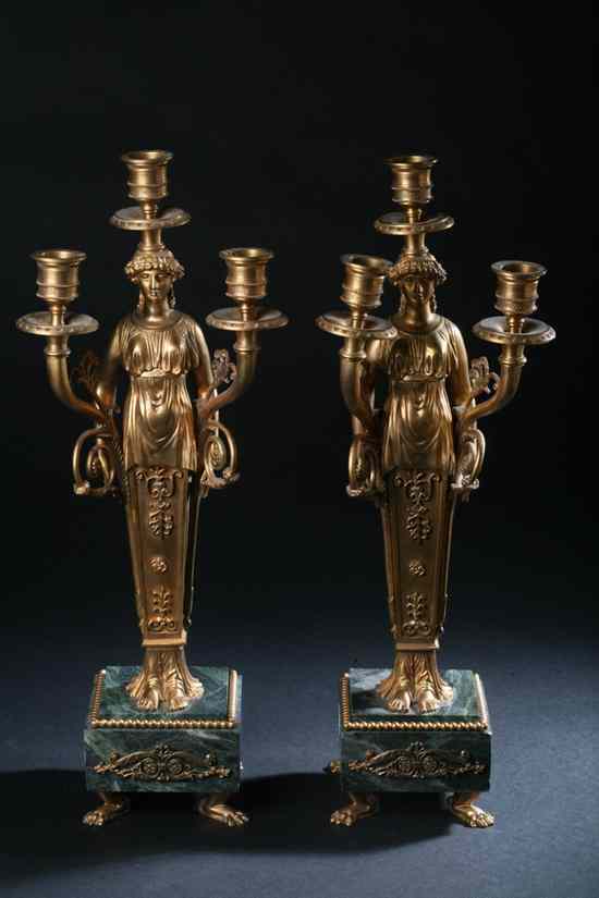 Appraisal: PAIR FRENCH EMPIRE-STYLE BRONZE-DOR THREE-LIGHT CANDELABRA th century Caryatid standard