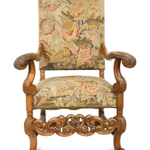 Appraisal: A Regence Style Carved Oak High Back Armchair with Needlework