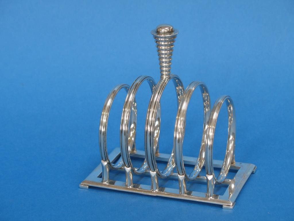 Appraisal: H G MURPHY A TOAST RACK with five bars in