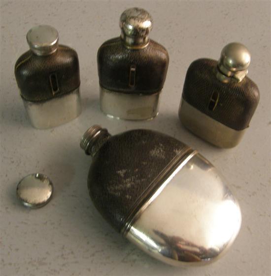 Appraisal: Four silver plated and leather mounted hip flasks each with