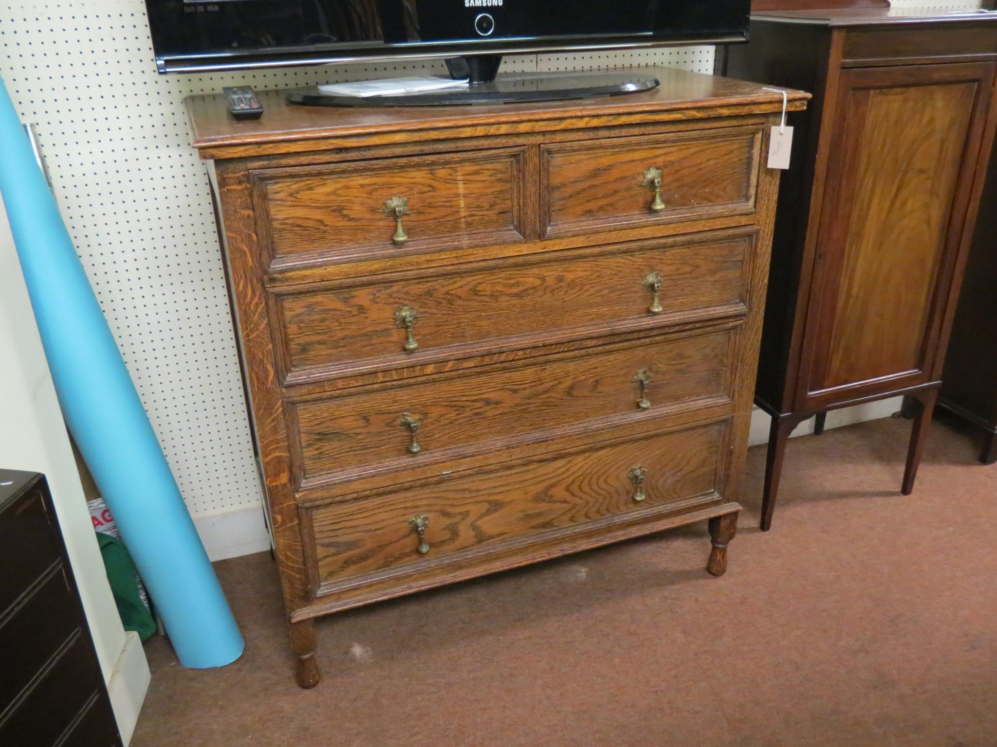 Appraisal: A solid dark oak chest two short and three long