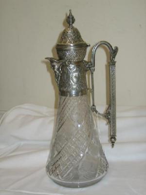 Appraisal: A GLASS CLARET JUG the EPNS mount with embossed lid