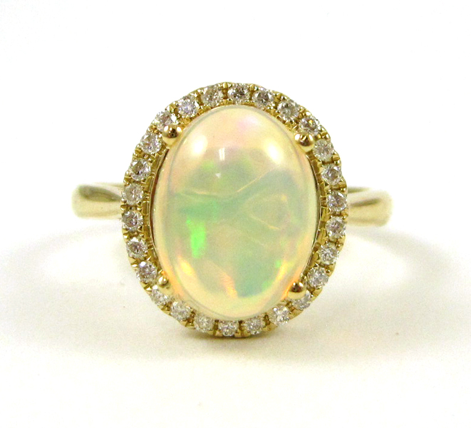 Appraisal: OPAL DIAMOND AND FOURTEEN KARAT GOLD RING with round-cut diamonds