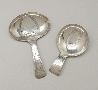 Appraisal: Two English silver caddy spoons both with engraved cartouche bowls