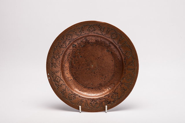 Appraisal: AN INDIAN DECCAN COPPER BRONZE CIRCULAR DISH with stylised foliate