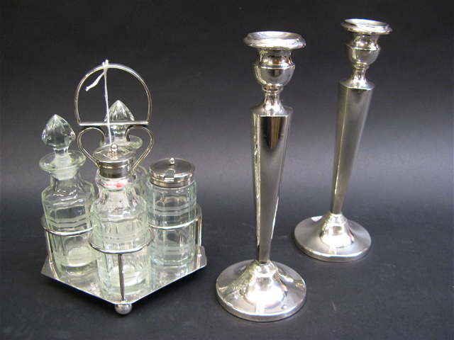 Appraisal: PAIR STERLING SILVER CANDLESTICKS A CASTOR SET The American candlesticks