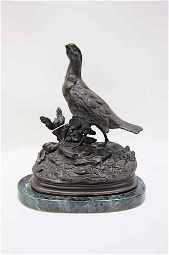 Appraisal: BRONZE SCULPTURE OF A GAME BIRD in landscape setting dark