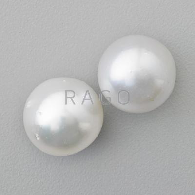 Appraisal: TWO LARGE WHITE SOUTH SEA PEARLS Semi spherical - mm