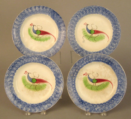 Appraisal: Four blue spatter plates th c with peafowl dia