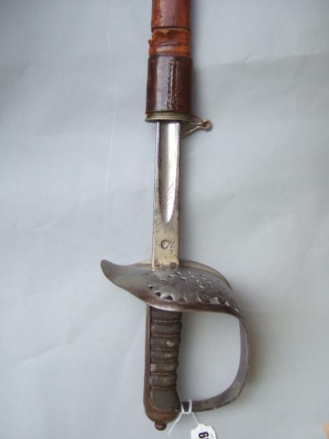 Appraisal: A Georgian officers sword with single edged engraved blade cm