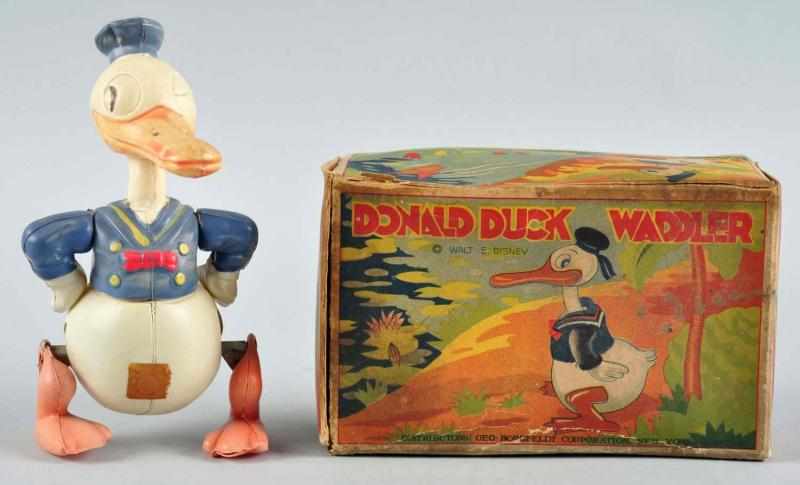 Appraisal: Celluloid Disney Donald Duck Waddler Wind-Up Toy Description Japanese Pre-war