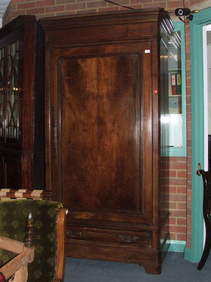 Appraisal: A FRENCH CHESTNUT ARMOIRE the interior fitted two shelves enclosed