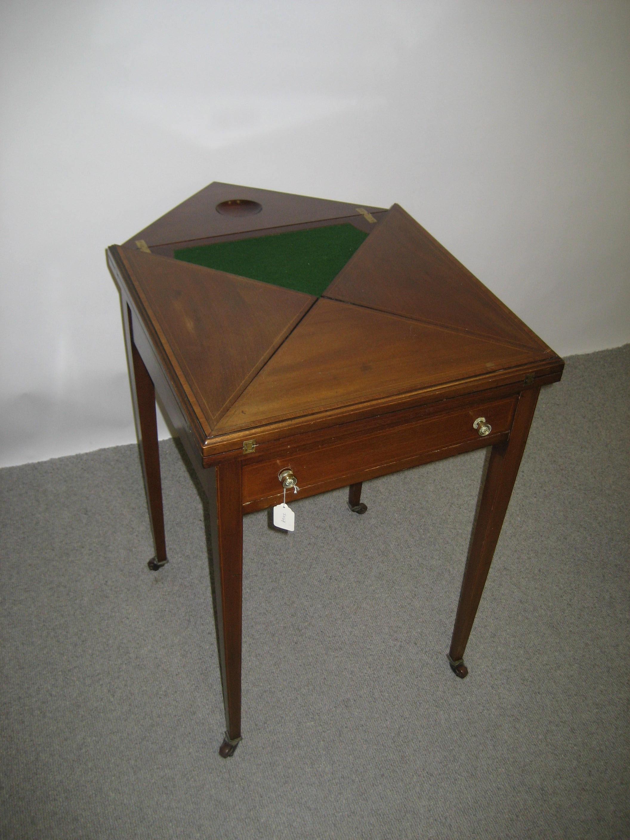 Appraisal: AN EDWARDIAN MAHOGANY ENVELOPE CARD TABLE with satinwood banding and