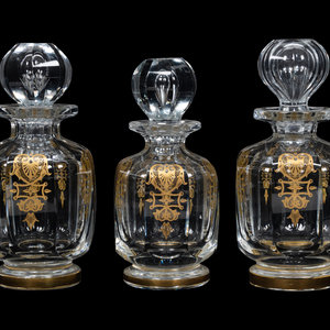 Appraisal: A Set of Three Baccarat Glass Decanters with Gilt Decoration