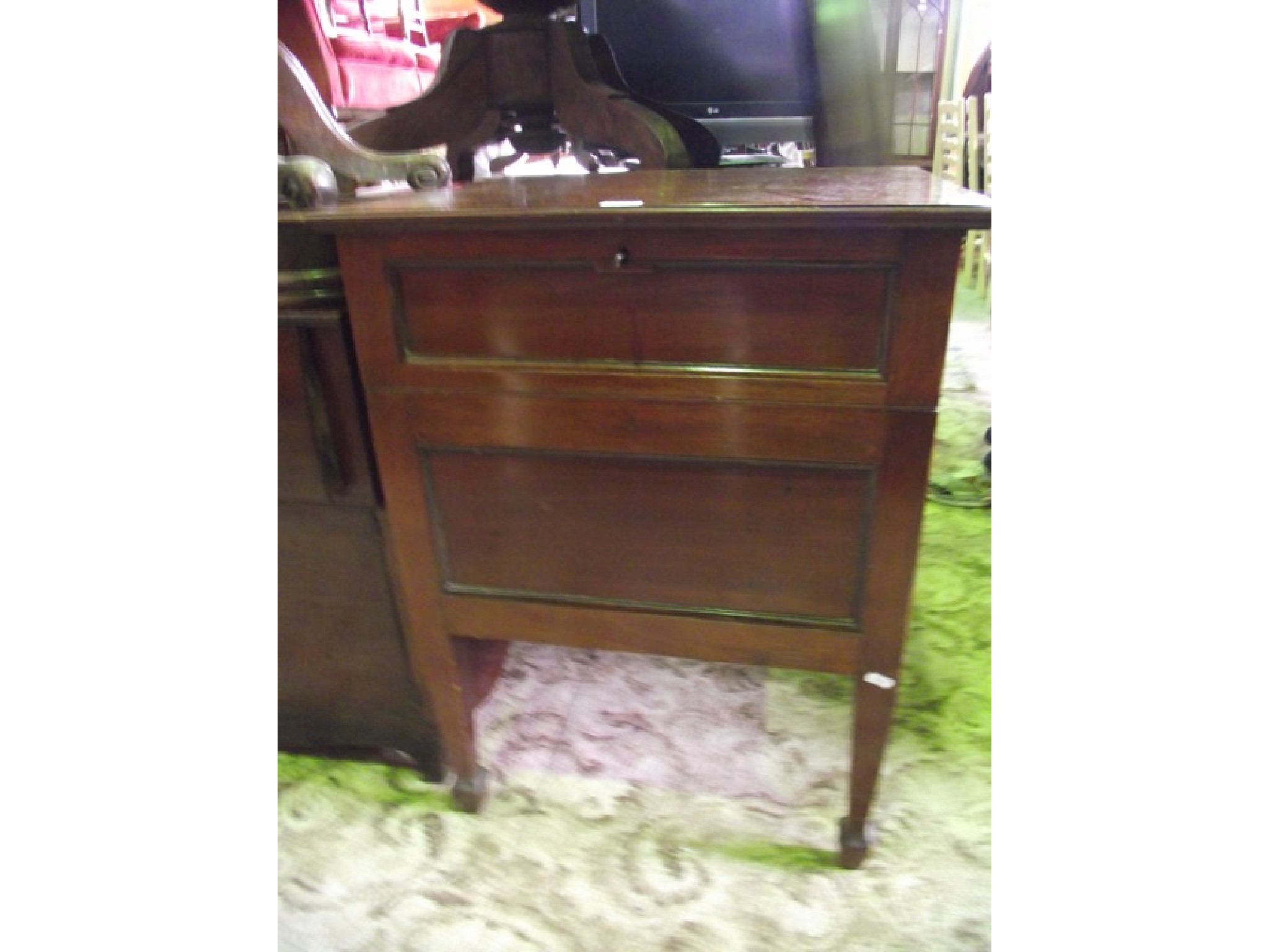 Appraisal: An Edwardian mahogany floorstanding drinks cabinet of square cut form