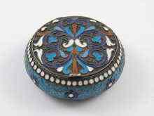 Appraisal: A Russian silver and enamel circular snuff box bearing marks