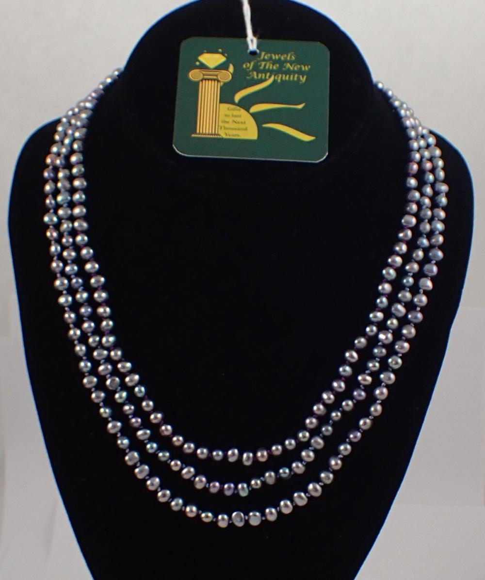 Appraisal: TRIPLE STRAND BLACK PEARL AND FOURTEEN KARAT GOLD NECKLACE three