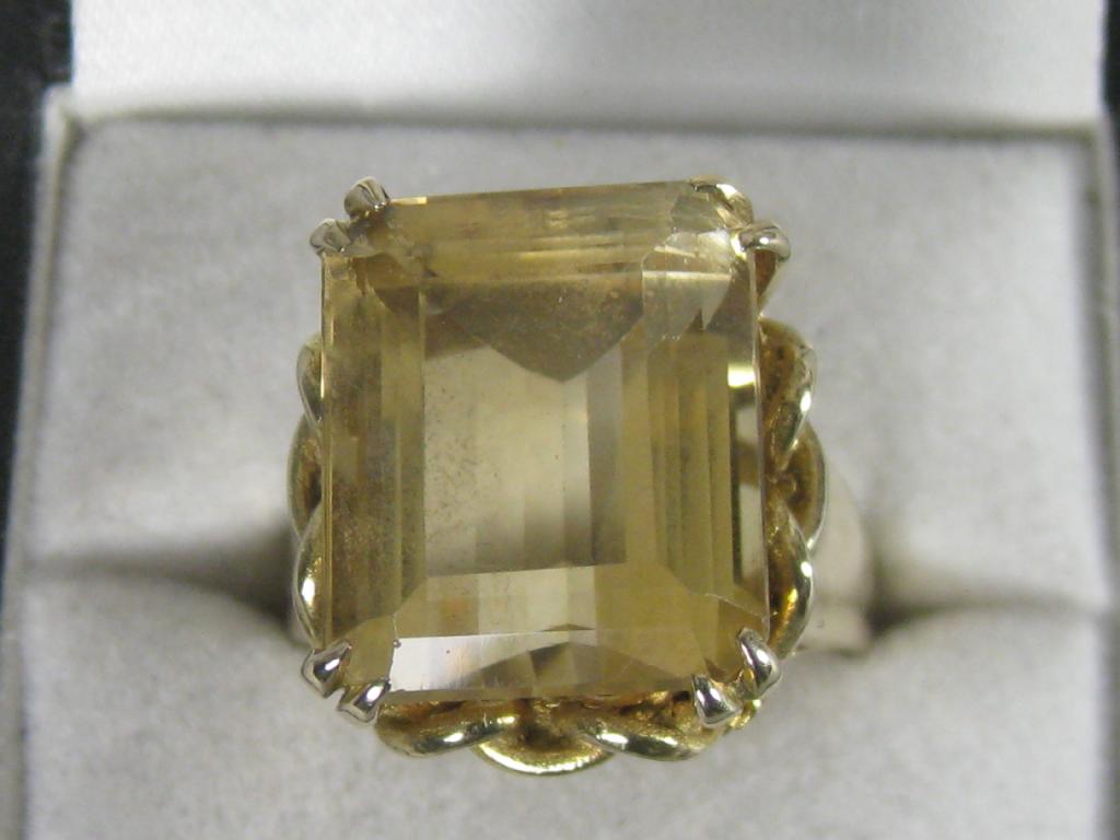 Appraisal: A Contemporary Citrine Ring the large step-cut stone claw-set in