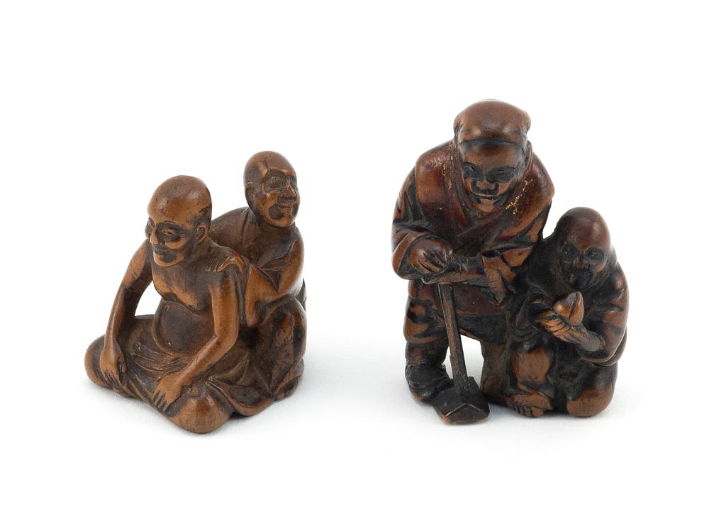 Appraisal: TWO JAPANESE CARVED WOOD FIGURAL NETSUKE MEIJI PERIODTWO JAPANESE CARVED