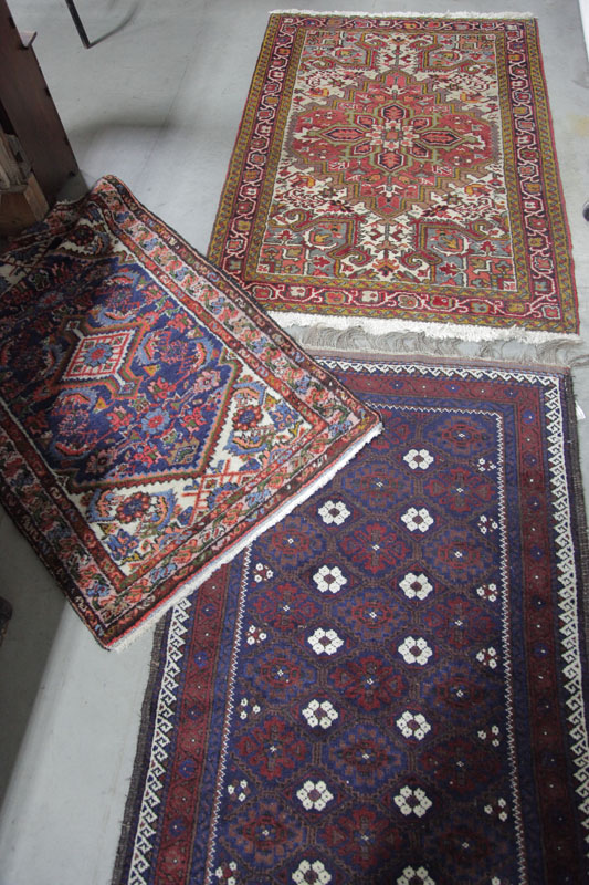 Appraisal: THREE ORIENTAL STYLE RUGS Blue ground with triple border and