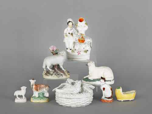 Appraisal: Eight Staffordshire tablewares to include spill vases figures a cradle