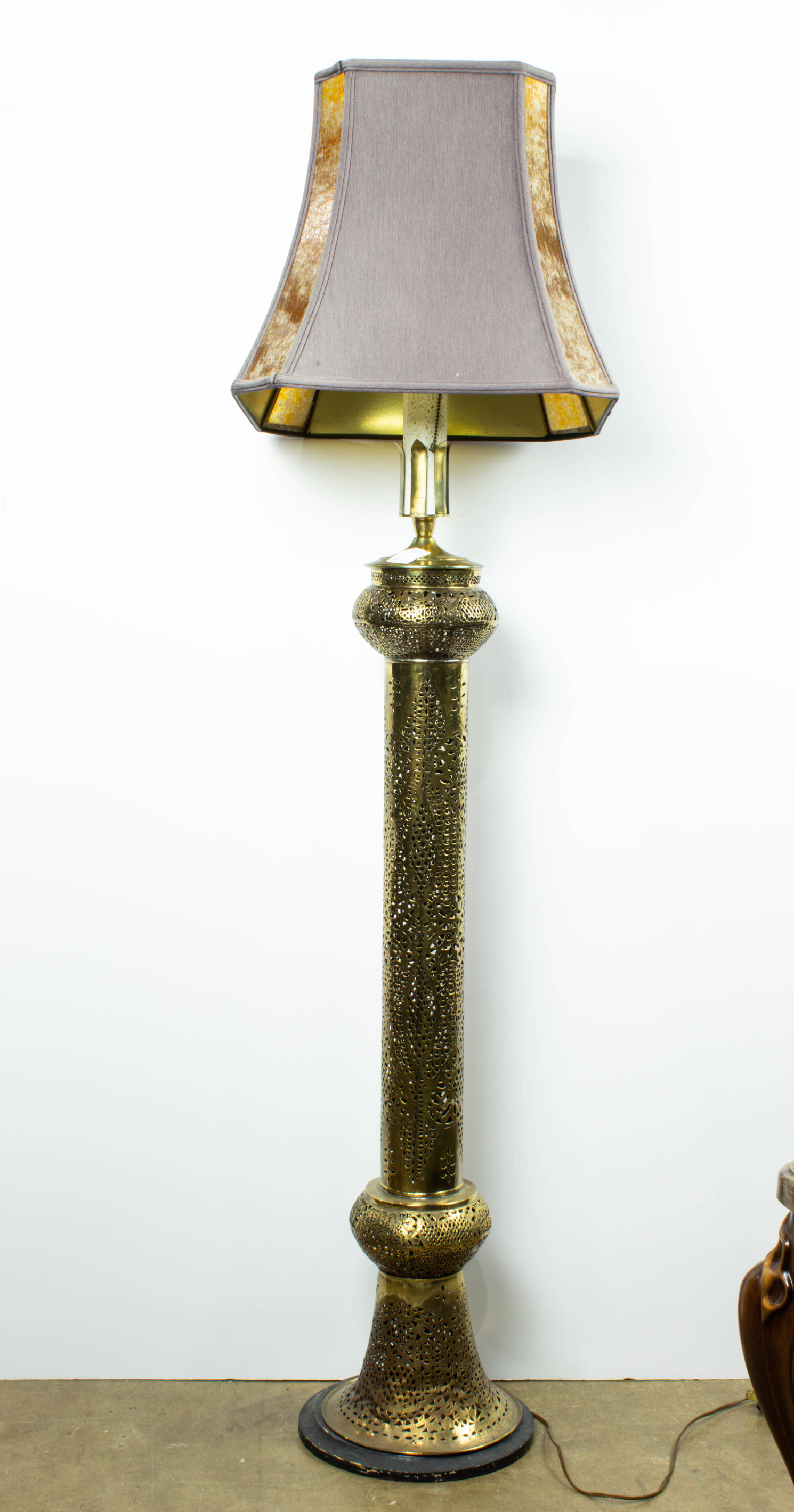 Appraisal: AN INDIAN BRASS TEMPLE FLOOR LAMP An Indian brass temple