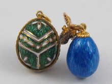 Appraisal: Two enamelled egg pendants in the Russian style cm and