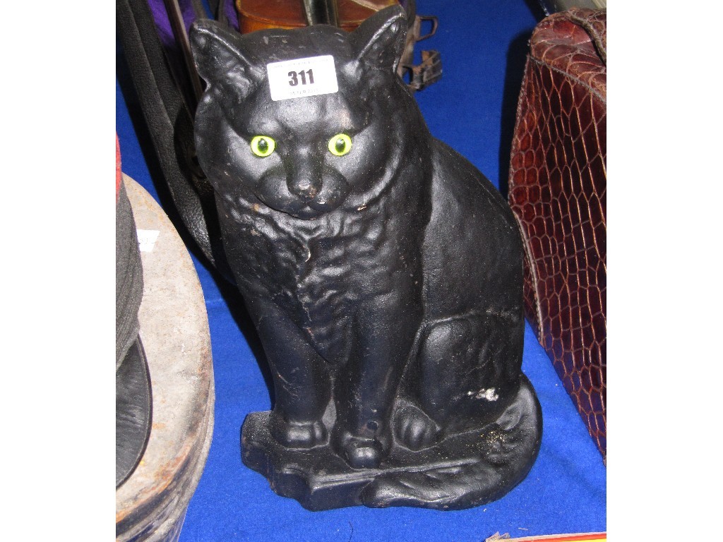 Appraisal: Black Cat' cast iron door stop