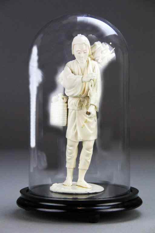 Appraisal: Japanese Carved Ivory OkimonoFinely carved to depict a villager with