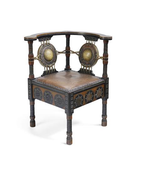 Appraisal: CARLO BUGATTI CORNER CHAIR CIRCA walnut stained walnut parchment cord