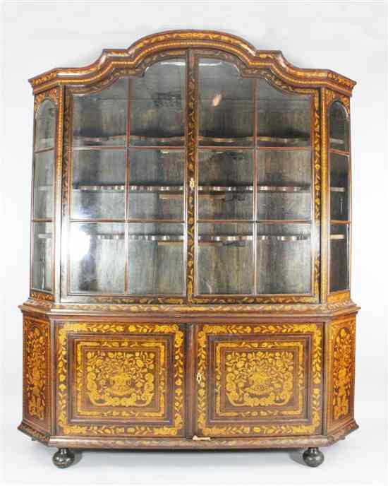 Appraisal: An th century Dutch marquetry inlaid walnut display cabinet with