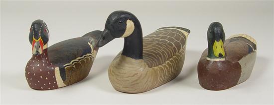 Appraisal: Three Hand-Carved Duck Figures Three hand-carved wooden figures of mallard