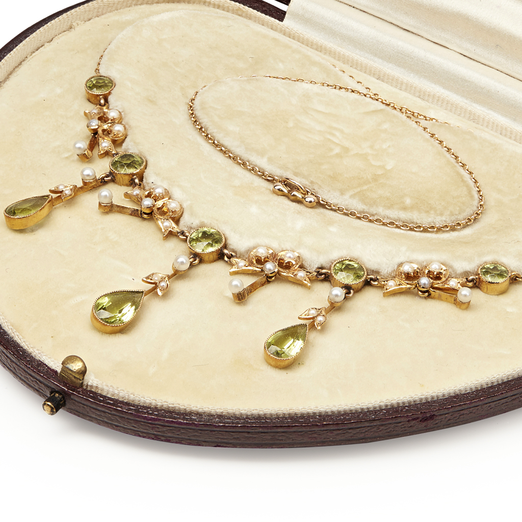 Appraisal: An early th century peridot and seed pearl set necklace