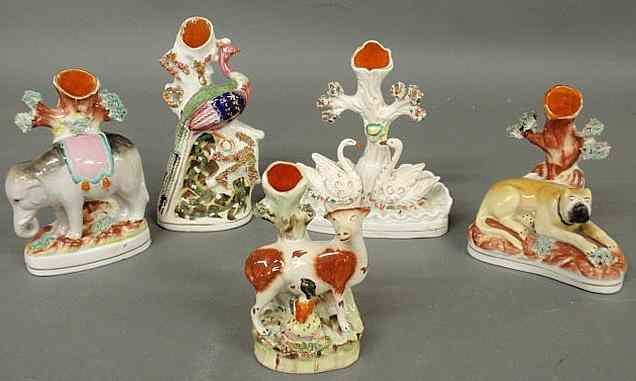 Appraisal: Five th c Staffordshire animal spill vases including a rare