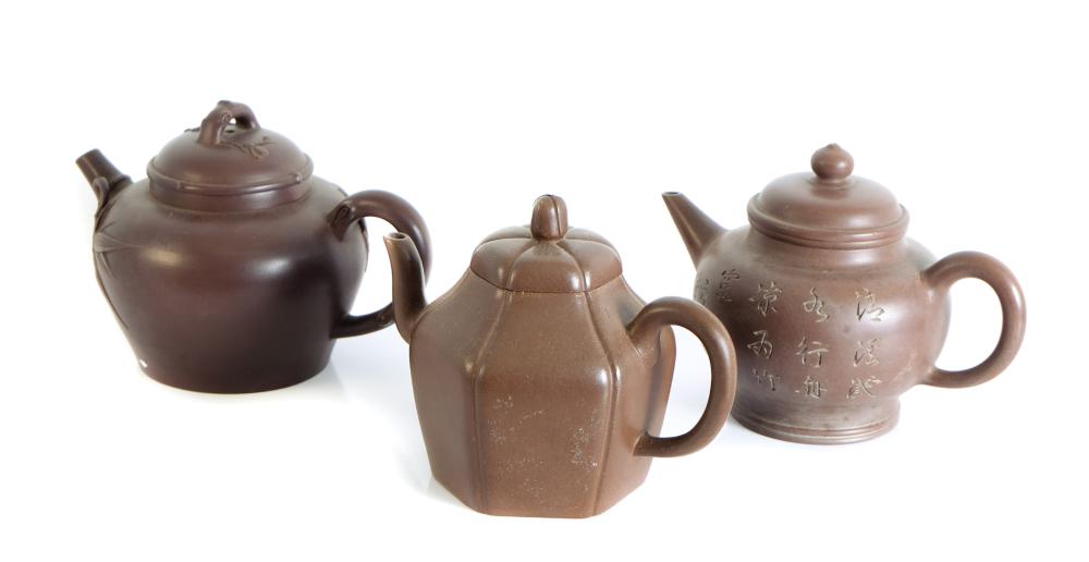 Appraisal: GROUP THREE YIXING STYLE CLAY TEAPOTS MARKEDGroup of three Yixing